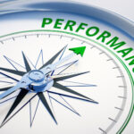 Compass dial pointing to word 'performance'