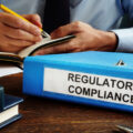 Regulatory compliance papers in the folder and manager.