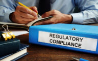 Regulatory compliance papers in the folder and manager.