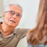 Senior man with social worker