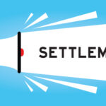 A meagaphone bearing the word 'settlement'