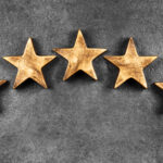 Five stars against dark background