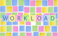 Post-it notes on a wall with the word 'workload' in the foreground
