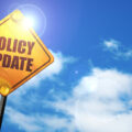 'Policy update' written on road sign