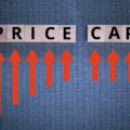 The word price cap written in blocks with red arrows pointing up to it