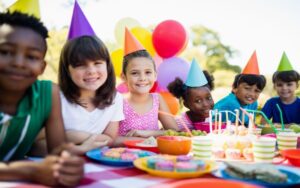 Closeup of birthday cake with candles By Anna Neubauer/ Adobe