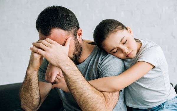 Child consoling parent/carer