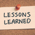 The message 'lessons learned' pinned to a corkboard