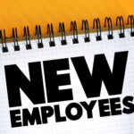 New Employees text on notepad, concept background