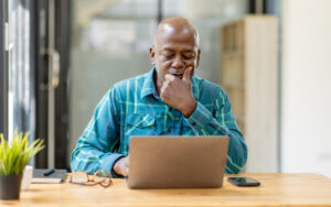 Man looking intently at his laptop