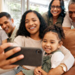 Family taking a selfie together looking happy