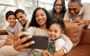 Family taking a selfie together looking happy