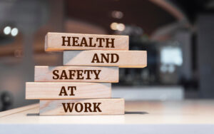 Wooden blocks spelling out 'health and safety at work'