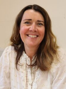 Colleen Male, Colleen Male, executive director for children’s services at Walsall. Colleen is looking directly at the camera and smiling. Her light brown hair falls to below her shoulders, and she is wearing a white blouse.