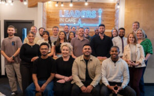 A group of staff from the organisation Leaders in Care in a group photograph