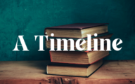 A stack of books positioned in front of a green wall with the title 'A Timeline' in front of them