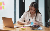 Social work student or young social worker doing some work at home on a laptop