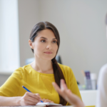 A social worker talking to a young person