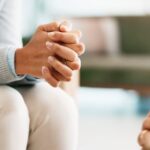 Psychology, counseling or woman hands with psychologist in consultation office for mind, assessment or evaluation. Therapy, anxiety or support for nervous patient with stress at mental health clinic