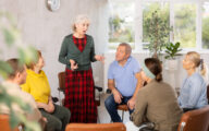 Older woman talking at a group meeting