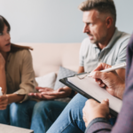 Social worker talking to an agitated couple