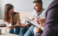 Social worker talking to an agitated couple