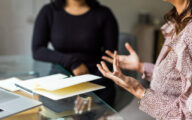 Independent reviewer interviewing a social worker for a case review