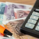 British Pounds, calculator and money file, financial settlements, household budget, taxes, British currency exchange rate, financial analysis, UK economic and business concept